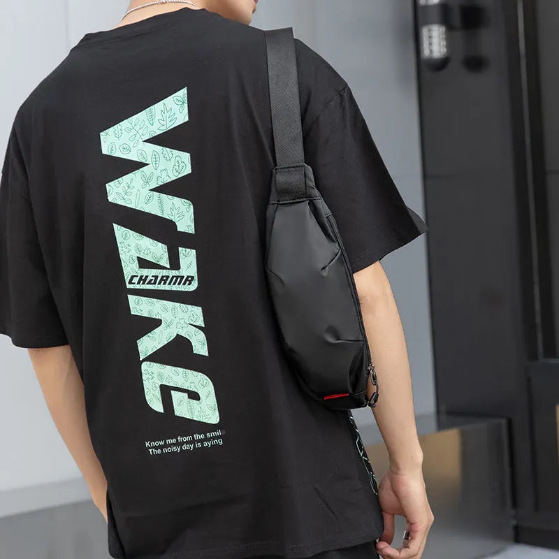 Black Oxford cloth waist pack with crossbody strap and zipper closure