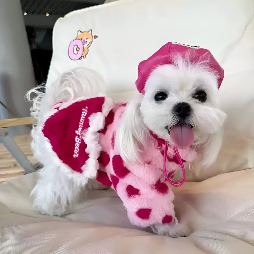 Small dog wearing British-style pink polyester plush winter coat suitable for Pomeranian or Bichon Frise breeds