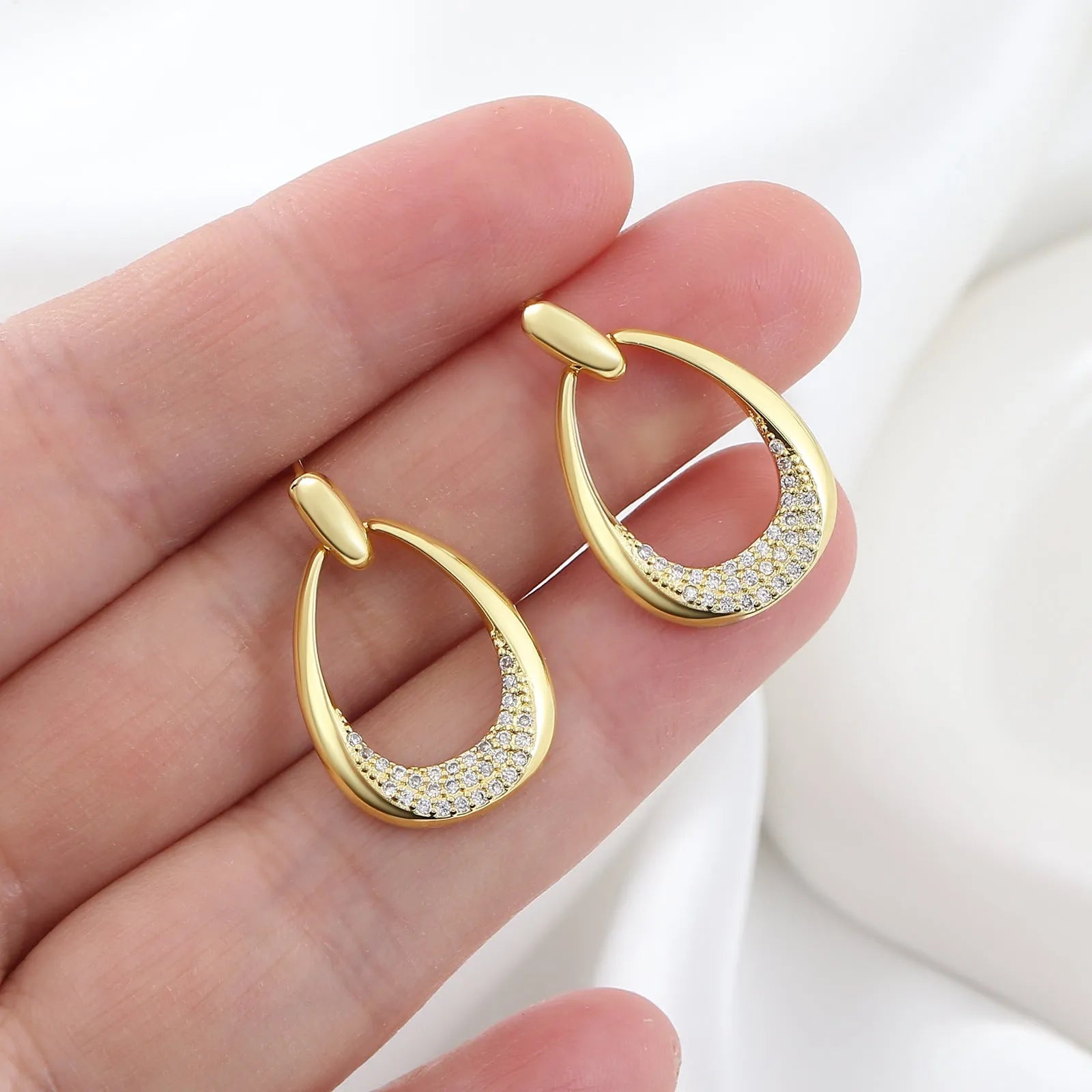 Yellow gold geometric drop-shaped women's earrings with a simple design.