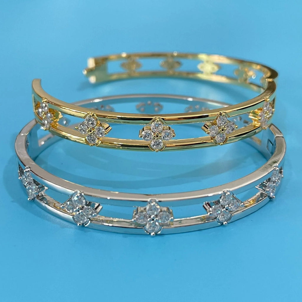 Gold and silver buckle options of hollow women's bracelet with four-leaf clover inlaid zircon design