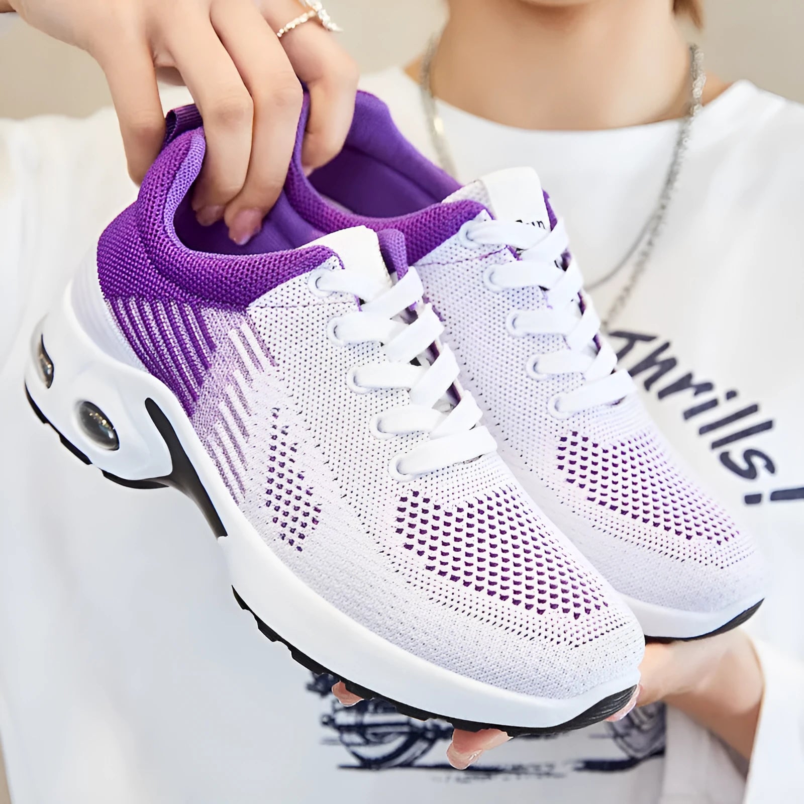 Women's striped Flyknit casual running shoes in pink with a round toe and flat PVC sole.