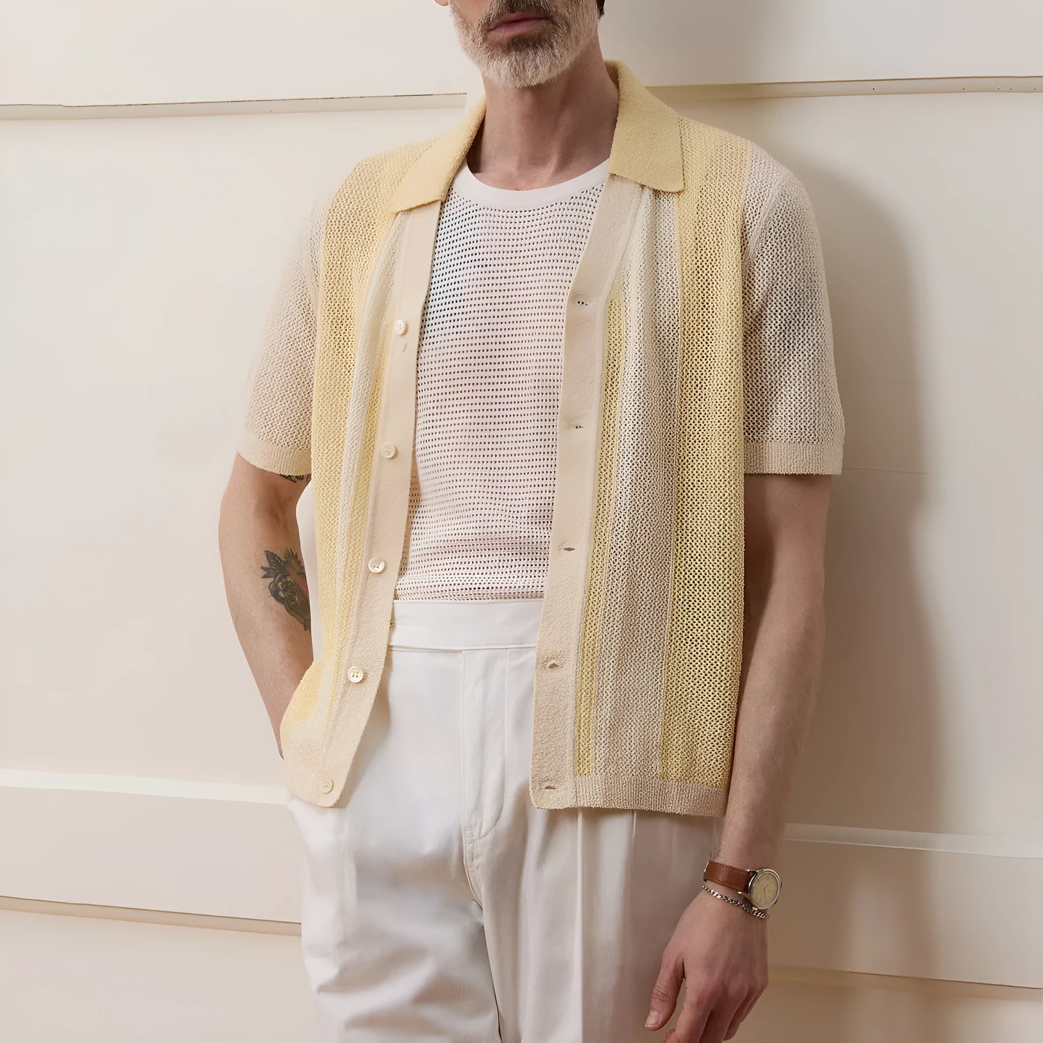 Yellow asymmetric hollow-out short sleeve polo shirt made from Tencel fabric on a model.