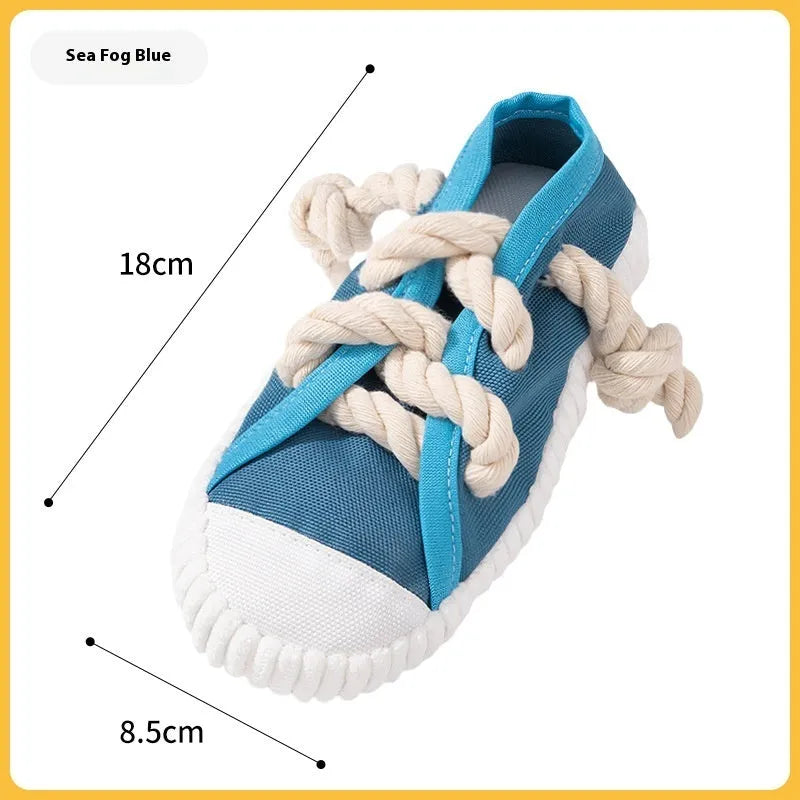 Plastic dog slipper chew toy with squeaker in black, blue, or yellow