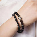 Ebony Tibetan bracelet with two circular beads in 8mm unisex sizing