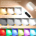 White plastic magnetic wall lamp with remote control showing 360-degree rotation and adhesive mounting