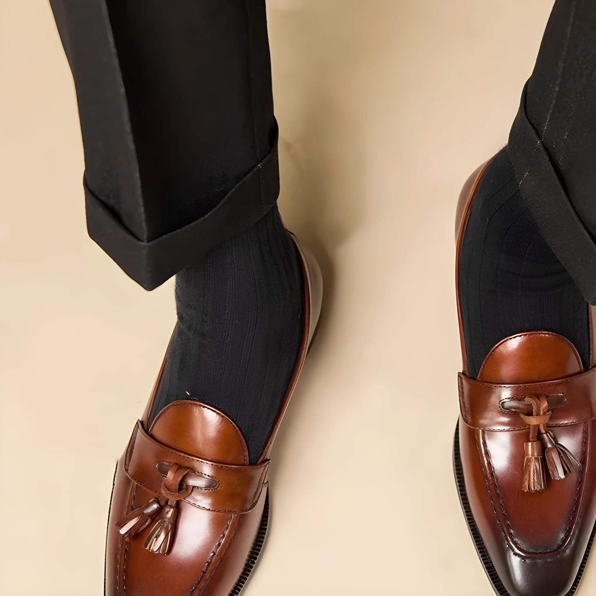 Men's black and brown polished leather tassel loafers with rubber sole