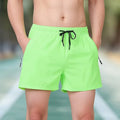 Black men's ice silk fitness training shorts with a high waist and drawstring, shown on a model.