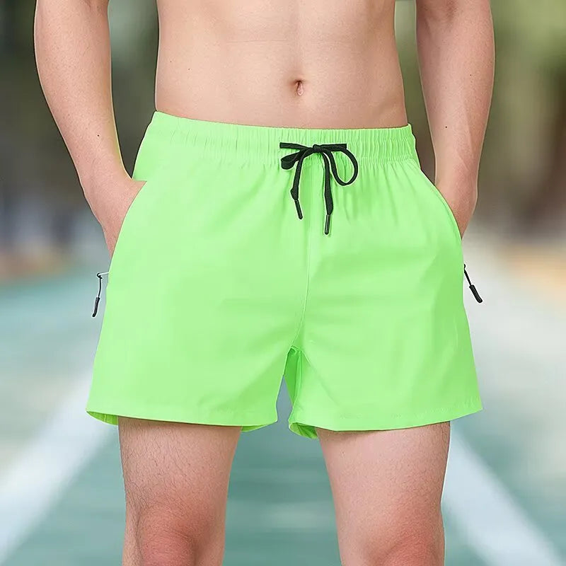 Black men's ice silk fitness training shorts with a high waist and drawstring, shown on a model.