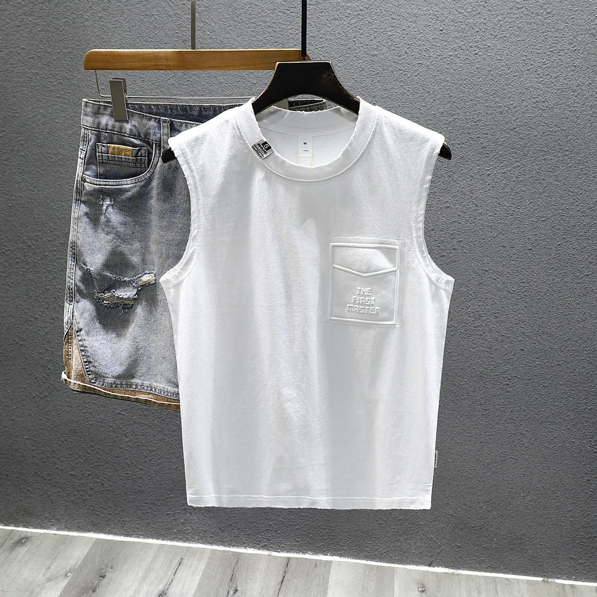 Black and white cotton sleeveless t-shirt with loose fit and straight hem design