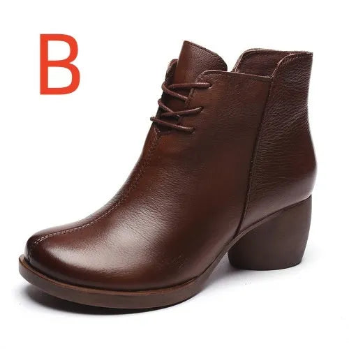 Women's black vintage Martin boots with thick heel and round toe made of leather.