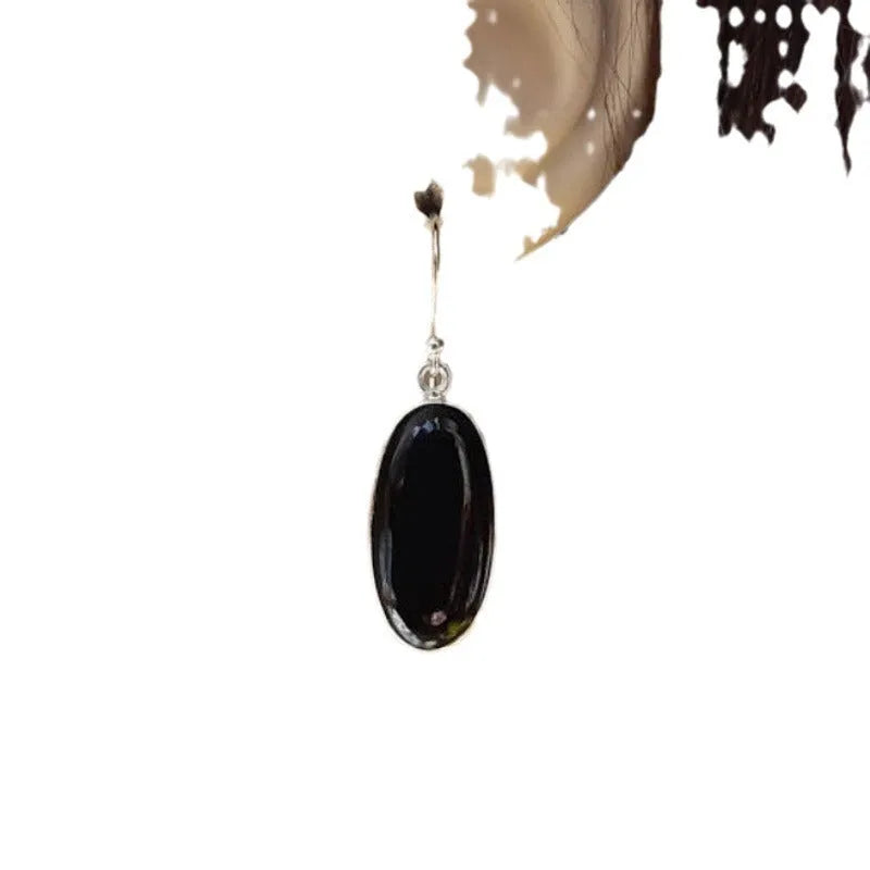 Women's oval black agate pendant earrings with geometric Chinese design on silver-style alloy