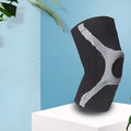 Red and grey silicone non-slip sports knee pads for running and climbing, shown in S, M, L, XL sizes.