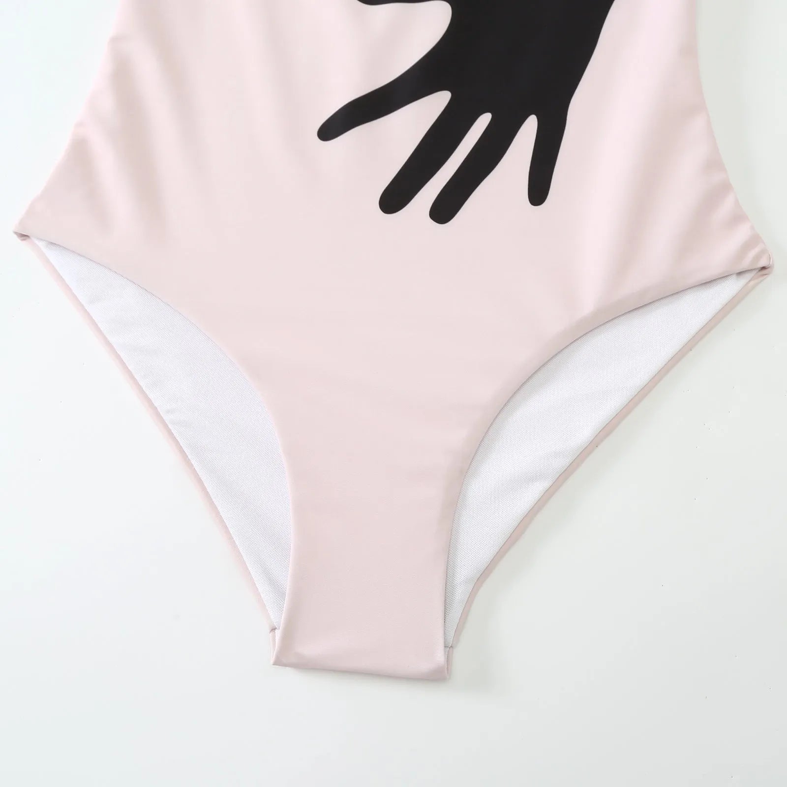 Women's one-piece bikini swimsuit with attached white tulle skirt on a mannequin.