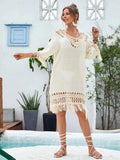 Apricot coloured hand-crocheted women's beach dress with a lining, shown on a model.