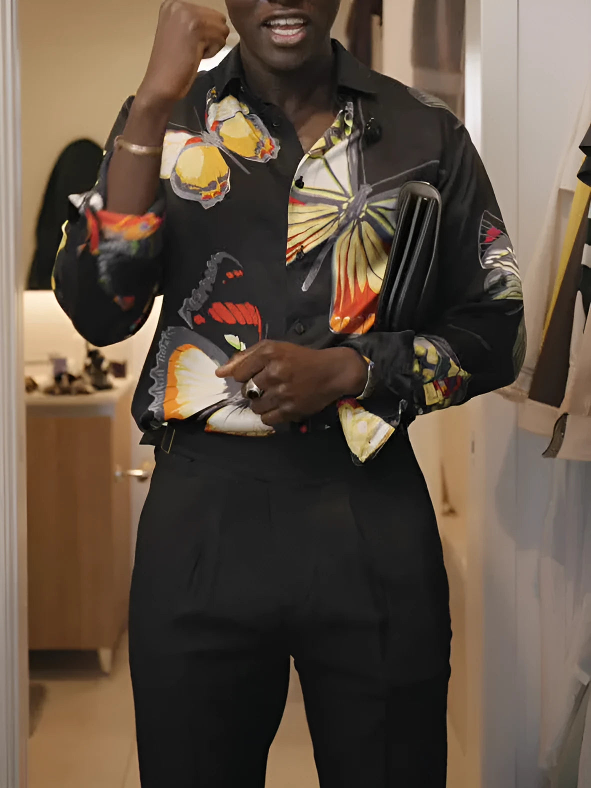 Black button-up shirt with vibrant butterfly motif, regular fit, polyester fabric, front view