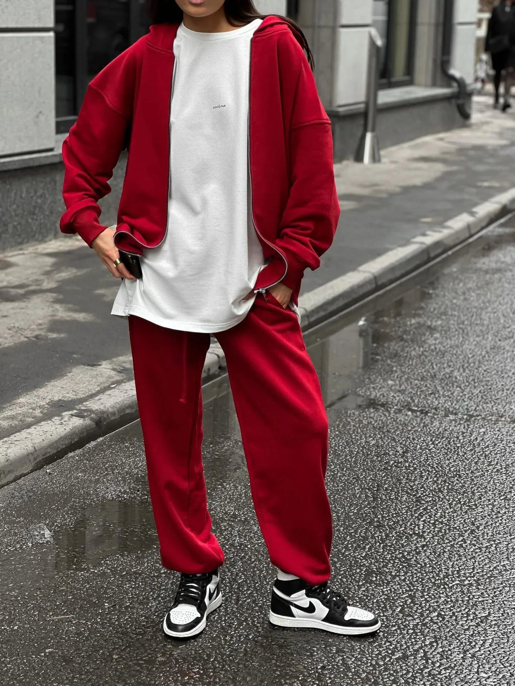 Street style loose fit two-piece set showing long-sleeved coat and matching trousers in solid colour