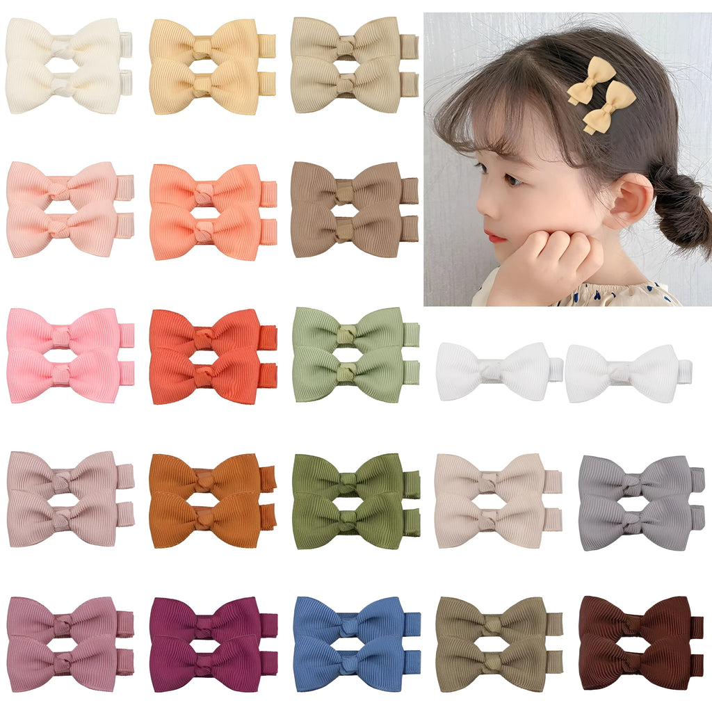 Set of pastel-coloured fully lined hair clips for babies and toddlers arranged by colour