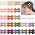 Set of pastel-coloured fully lined hair clips for babies and toddlers arranged by colour
