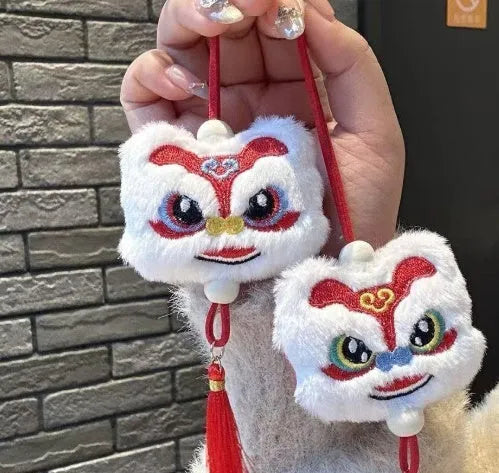 Blue Chinese style plush lion keychain ornament with tassels and star stone detail