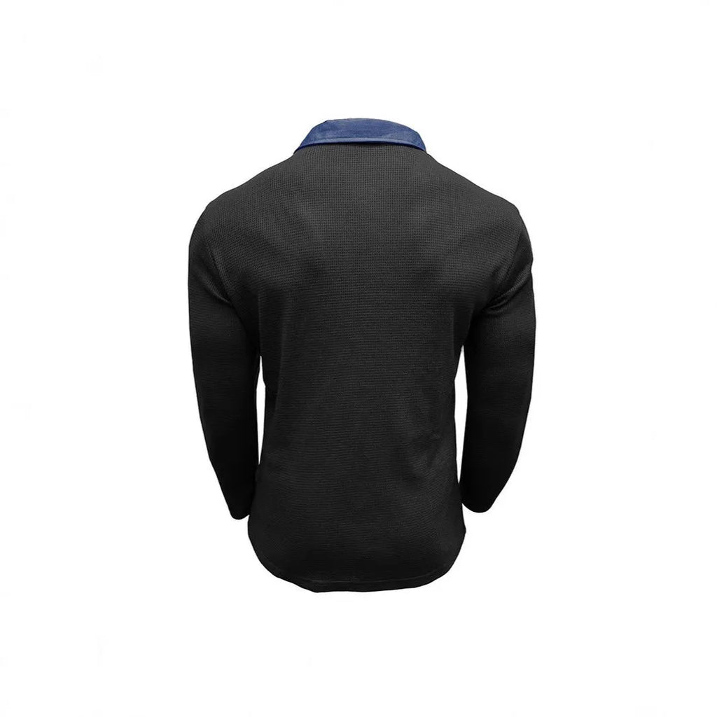 Man wearing a long-sleeved waffle-texture polo shirt in a solid colour with an asymmetric design detail.
