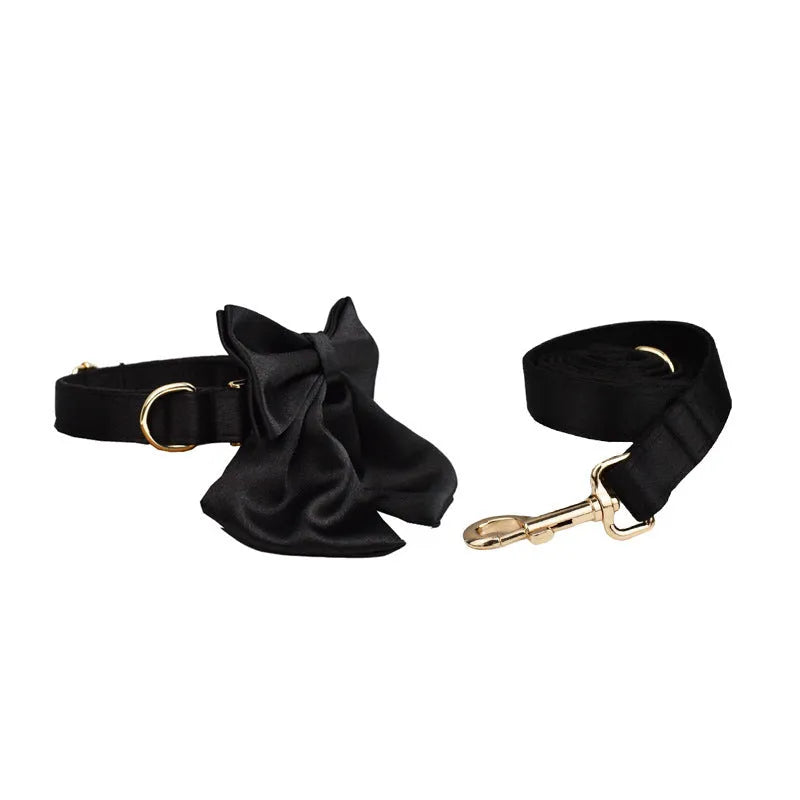Complete dog walking set showing collar, leash, decorative bow, and vest piece in coordinated colours