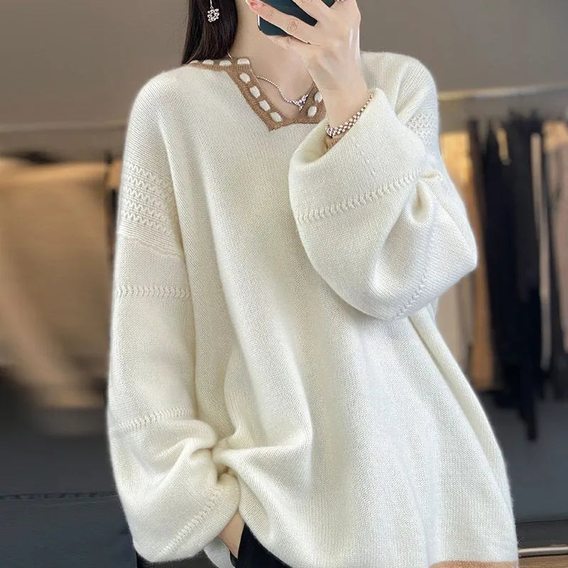 Camel coloured women's V-neck viscose pullover sweater with long sleeves on a hanger.