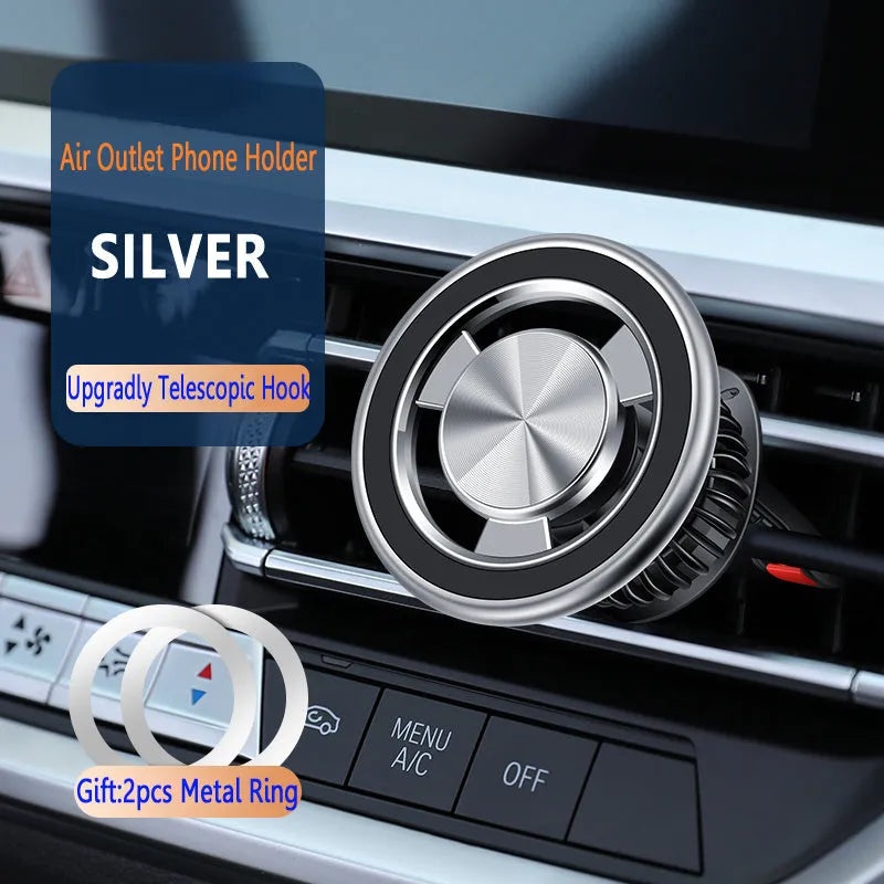 Silver magnetic car phone holder mounted on vehicle air vent with phone attached
