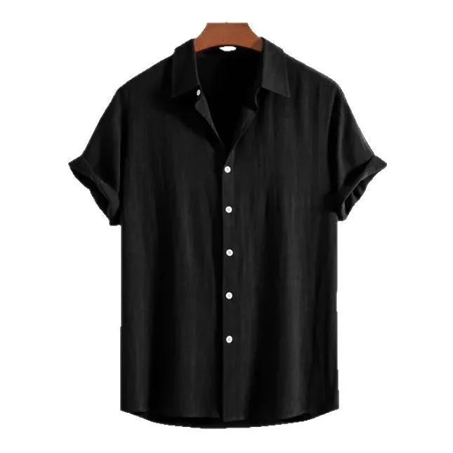 Man wearing a loose green short-sleeve cardigan-style beach shirt made from cotton and linen.