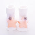 Cotton baby socks in multiple colours including blue bow and pink stars on a white background