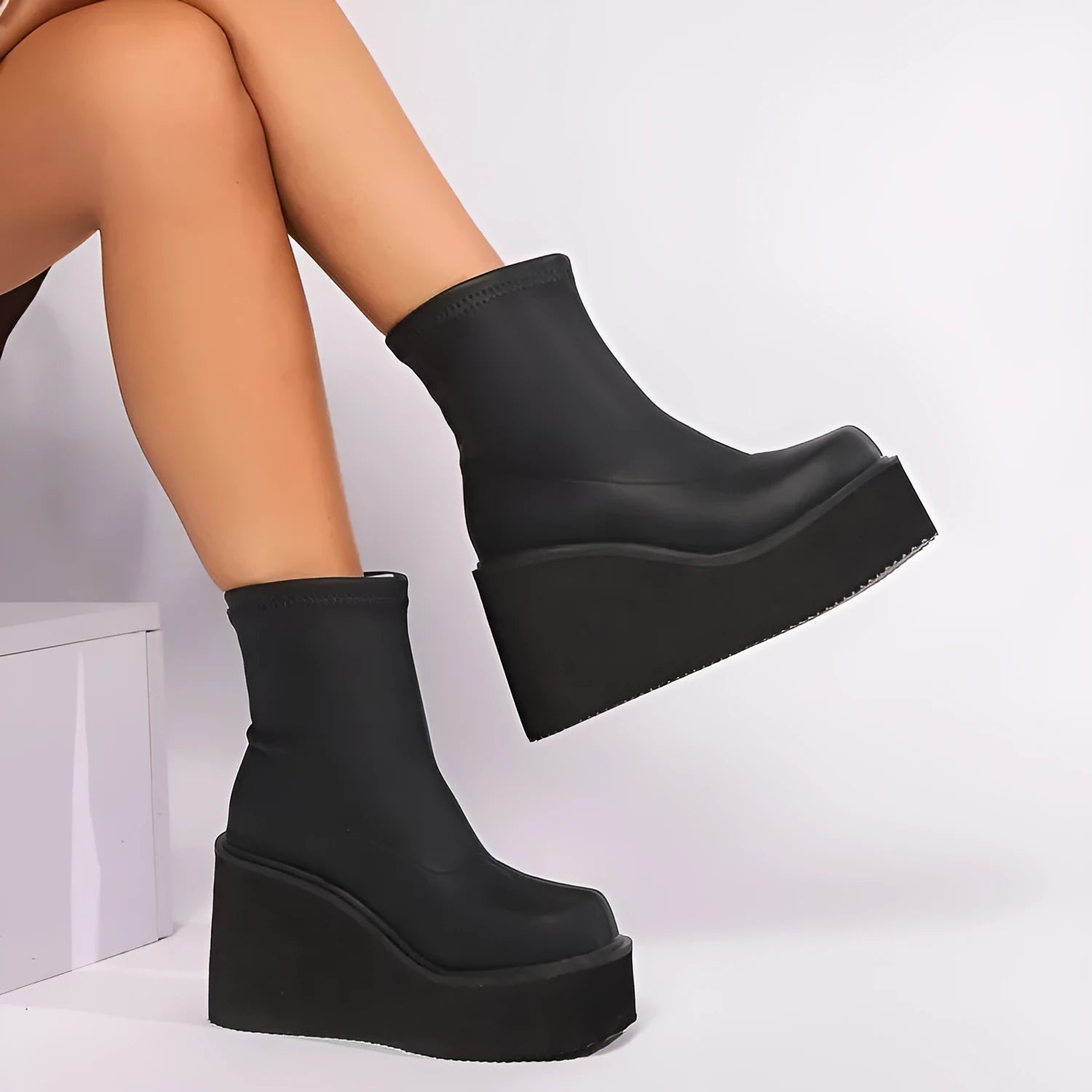 Black plus size women's boots with wedge heel and waterproof platform in short and high shaft styles