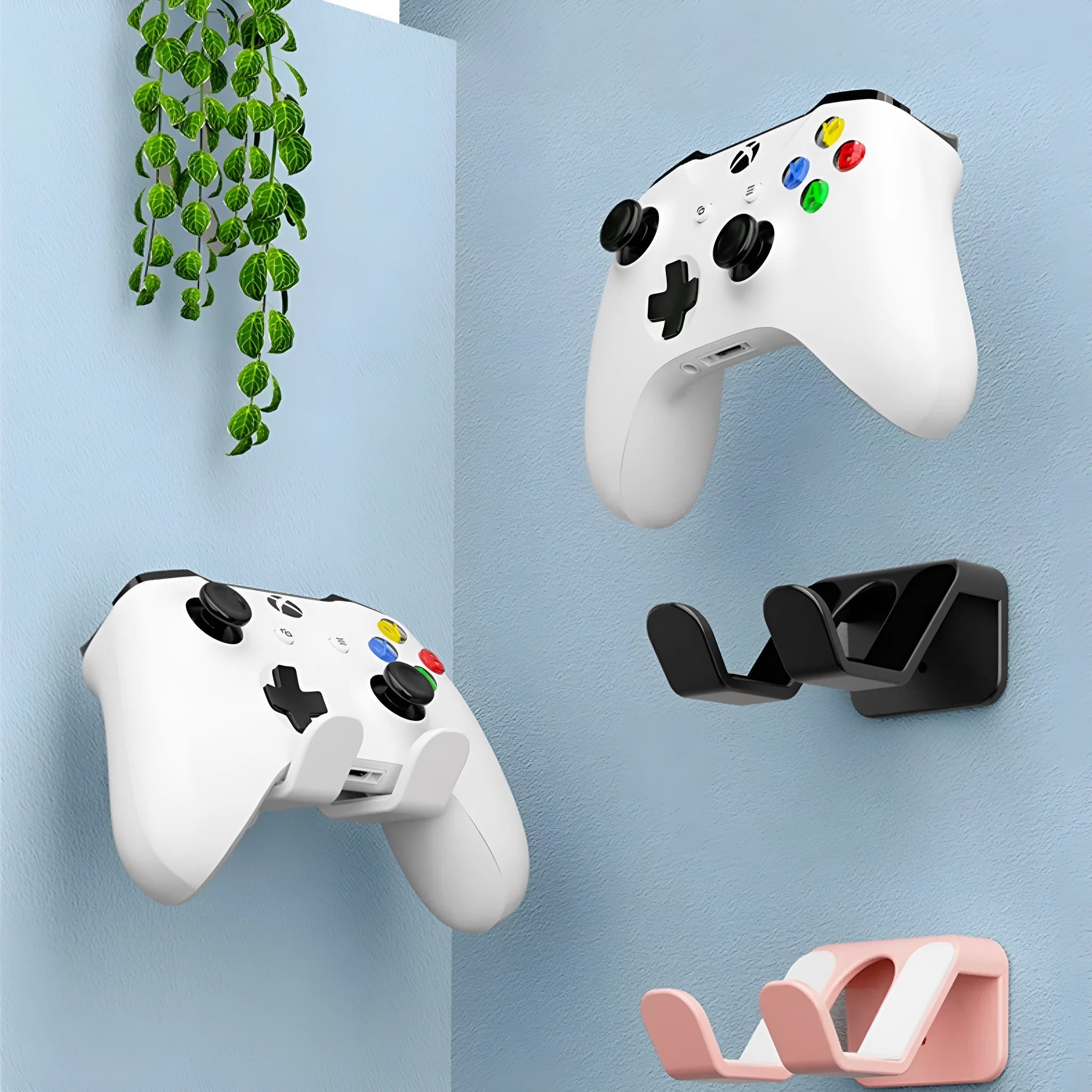 Black ABS plastic wall-mounted rack holding two game controllers with X-shaped handle design.