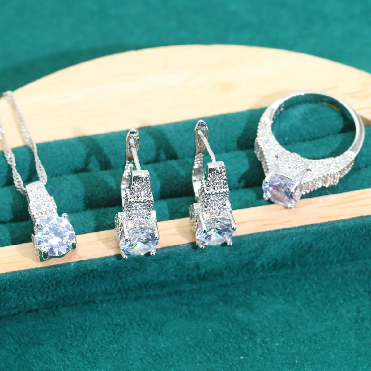 Bridal jewellery set with zircon accents showing necklace, earrings, ring, and bracelet in alloy construction