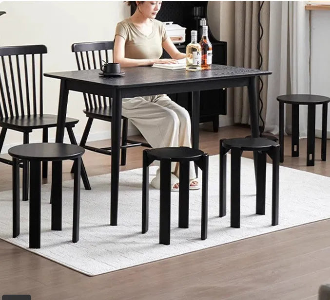 Four stackable round iron dining stools in modern design with graphic customisation options