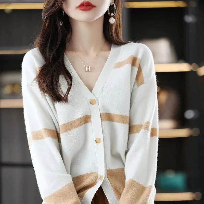 Women's striped V-neck knit cardigan buttoned up, shown in a slim fit.
