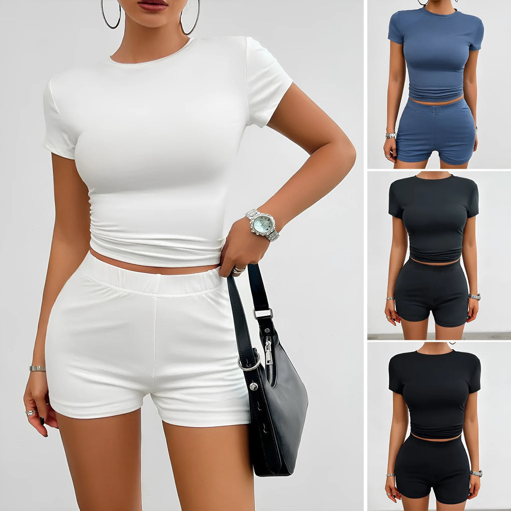 Womans solid colour slim-fit two-piece sport set with short sleeve t-shirt and elasticated shorts.
