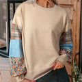 Women's beige and red plaid stitching long-sleeved loose fit casual top.