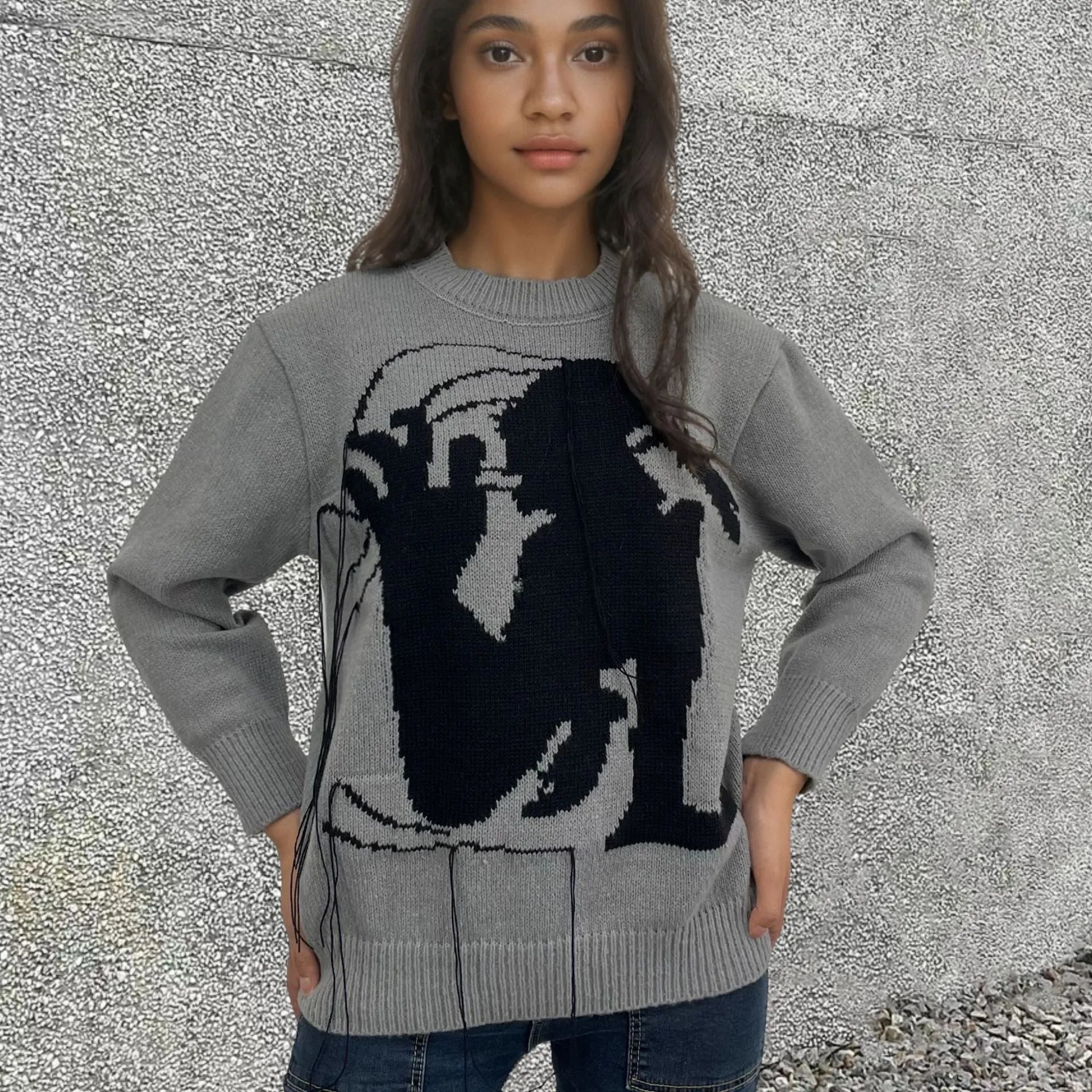 Women's grey alpaca wool pullover sweater with tassel detailing and abstract pattern