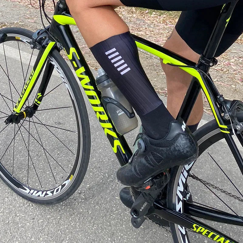 A pair of breathable athletic sports socks for cycling and running, shown in one of six available colours.