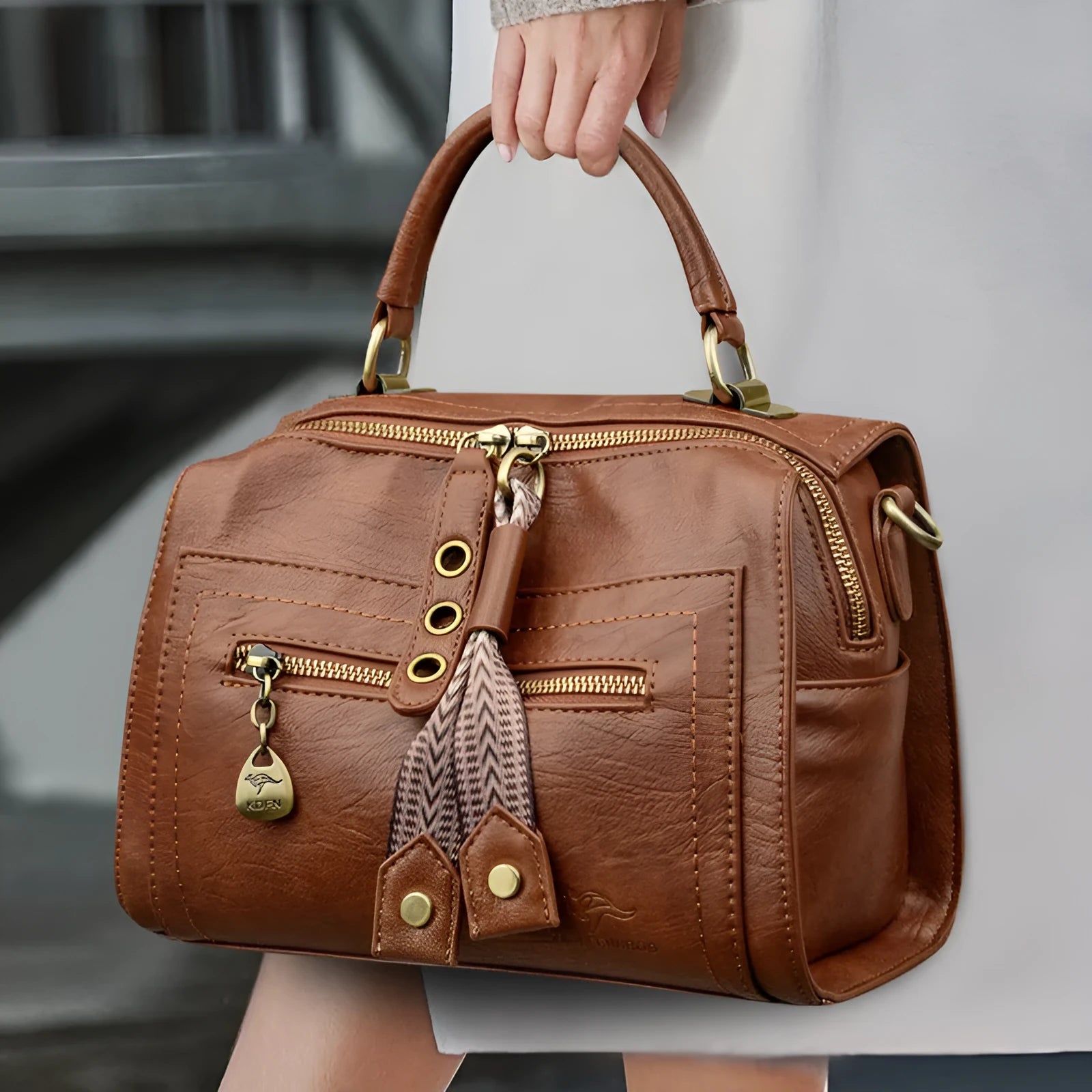 Gray soft PU leather women's crossbody bag with a horizontal square shape and a front sandwich pocket.