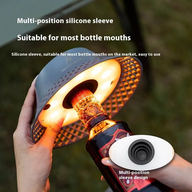 Beige wine bottle-shaped camping lantern with USB-C charging port and LED light