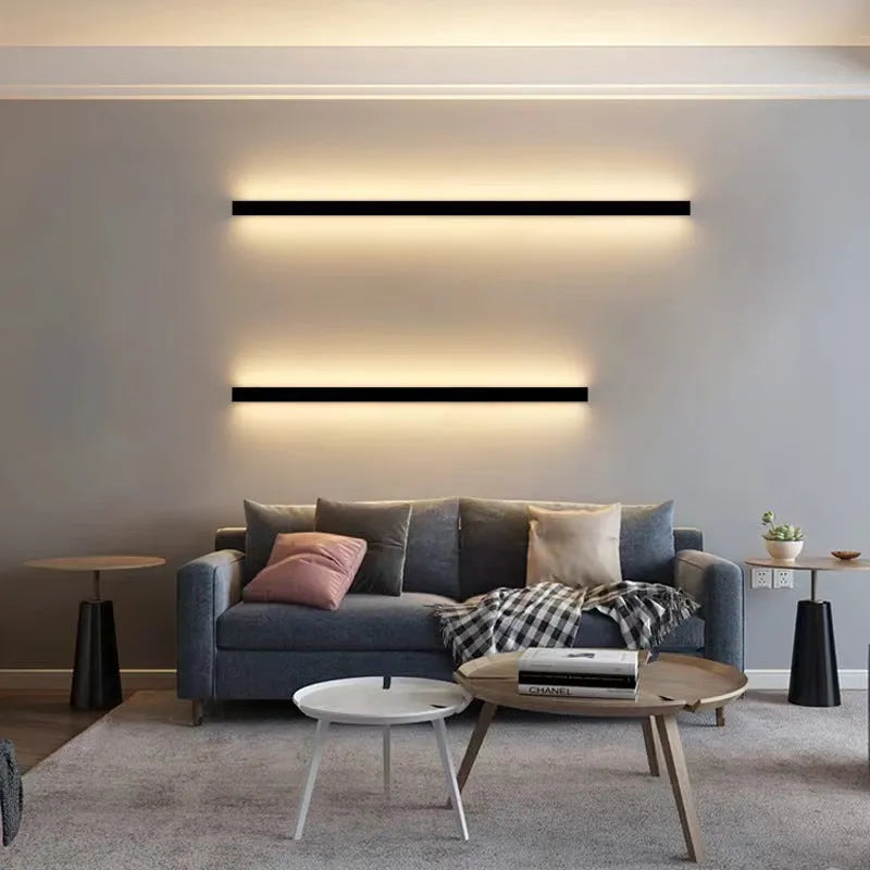 80cm long black aluminium in-line LED wall lamp with a PC shade on a white wall.