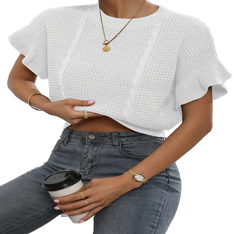 Knitted pullover sweater with ruffled short sleeves and a textured 3D pattern in a loose fit.