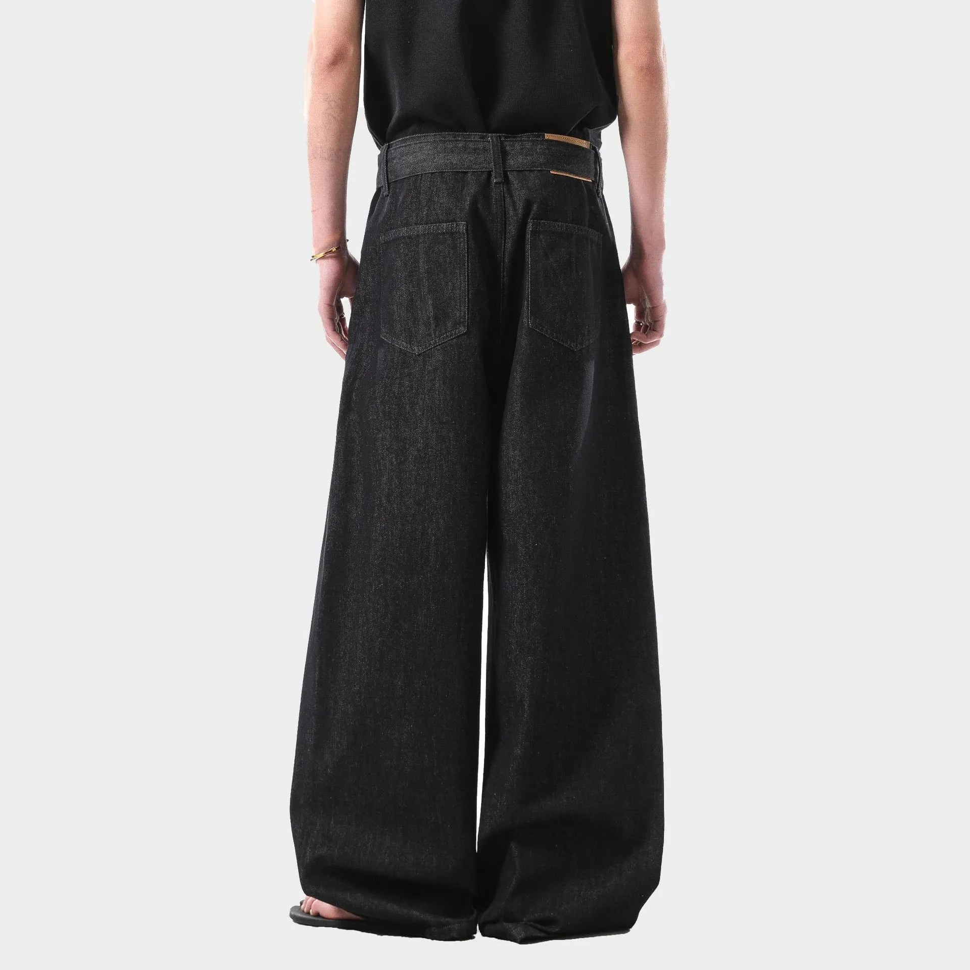 Black high waist straight leg jeans with gold accents and retro American styling details