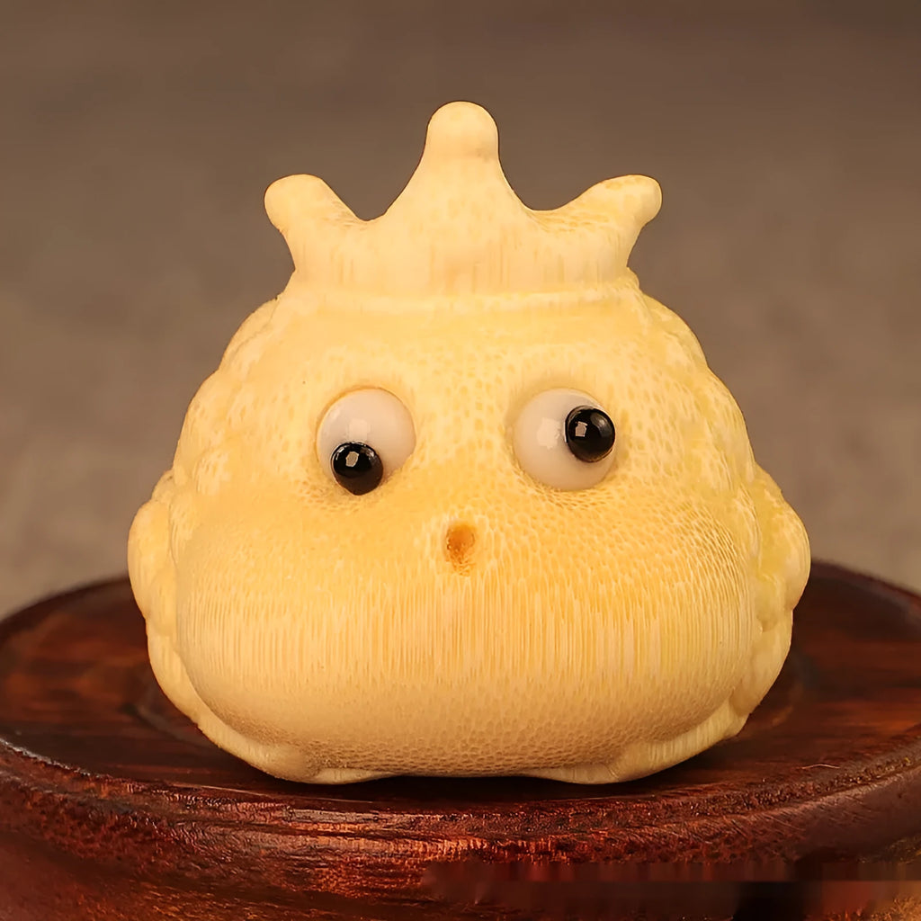 Solid bamboo carving of a Crown Princess Toad ornament with live eye design.
