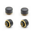 Four black Bluetooth tyre pressure sensors for mobile phone monitoring display