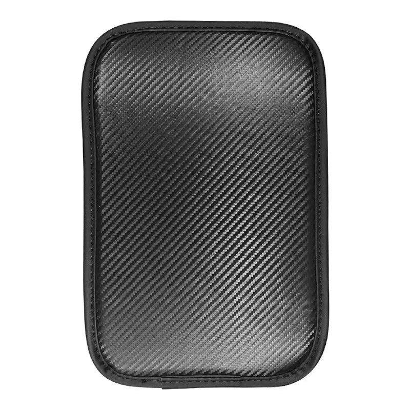 Automotive carbon fibre armrest box mat in black leather, 29x19cm, on a car centre console