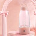 Automatic electric shaker bottle in green, pink, or white with USB charging port and handle.
