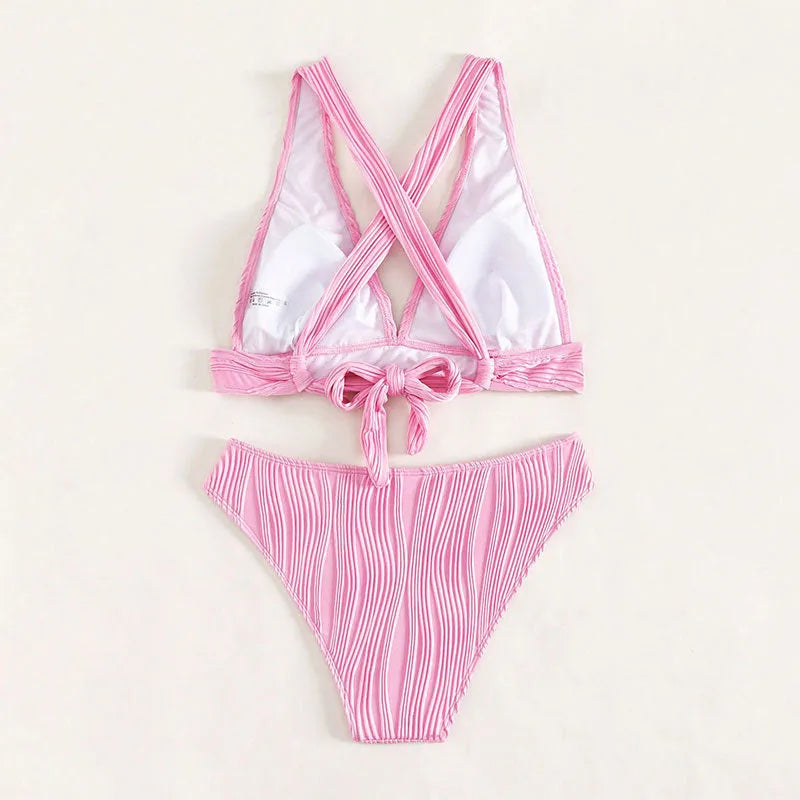 Pink and black women's halter strap bikini swimsuit set on a mannequin.
