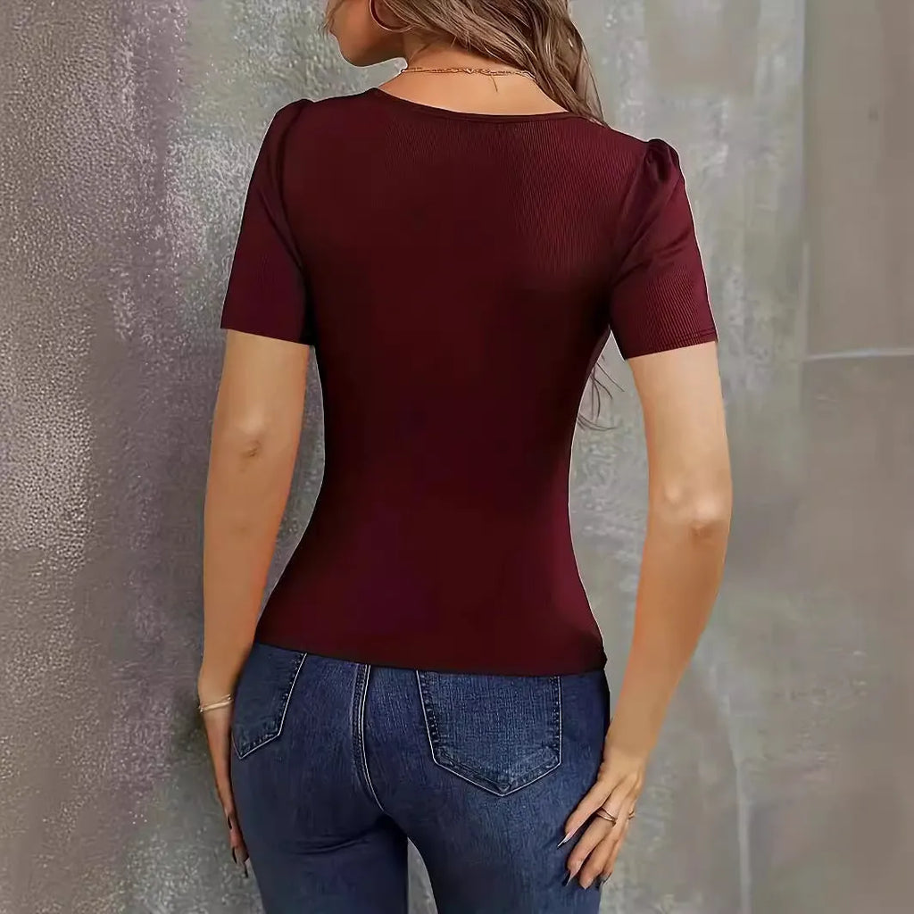 Women's wine red slim fit knitted short sleeve top with low V-neck on a model