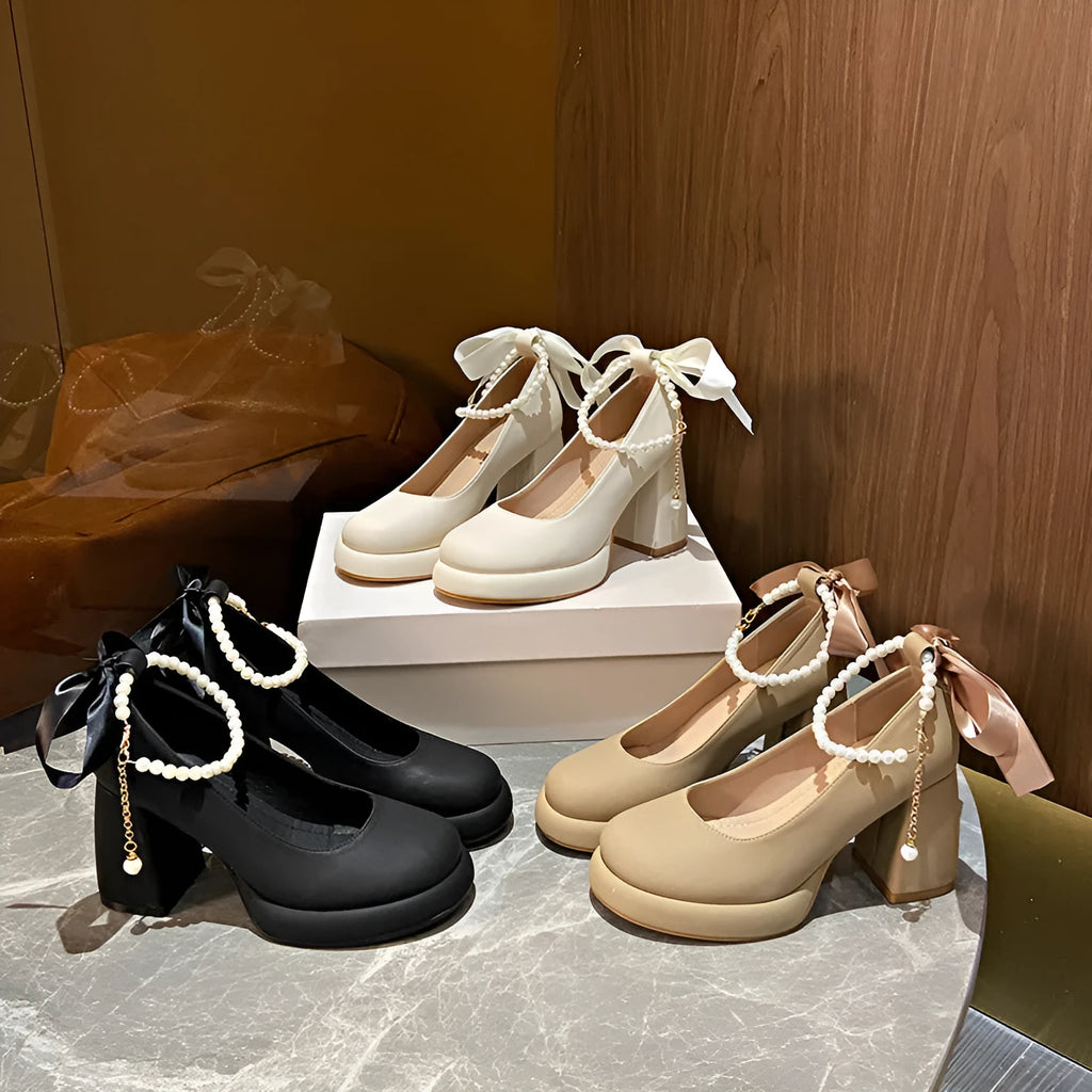 Beige women's Mary Jane shoes with a chunky heel and an ankle-strap buckle on a round toe.